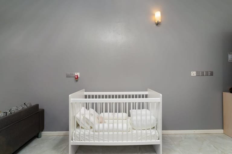 Travel cot set up in a bedroom at Maafolhey Han'dhaan, available on request.