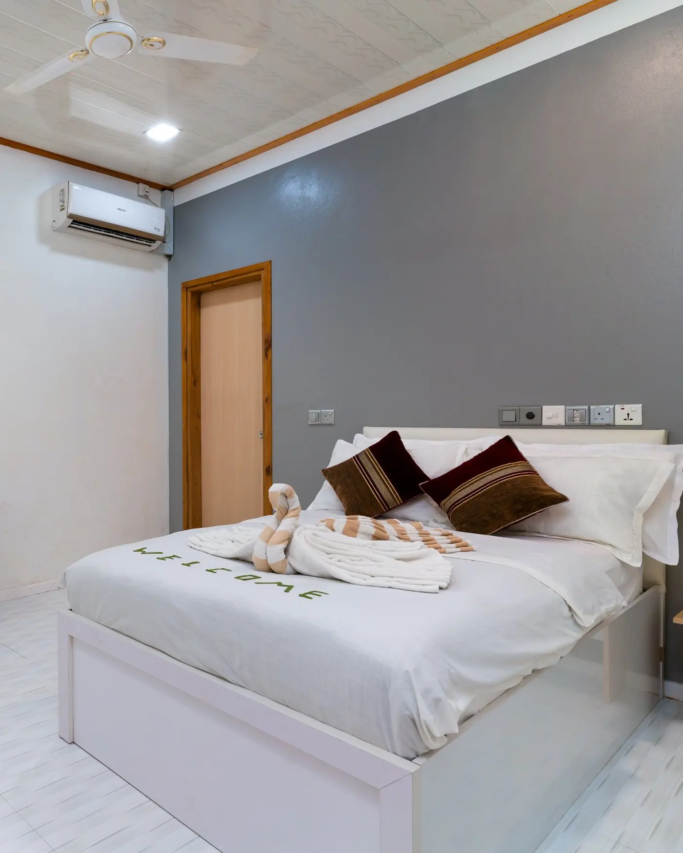 A bedroom at Maafolhey, part of the whole home rather than a hotel room