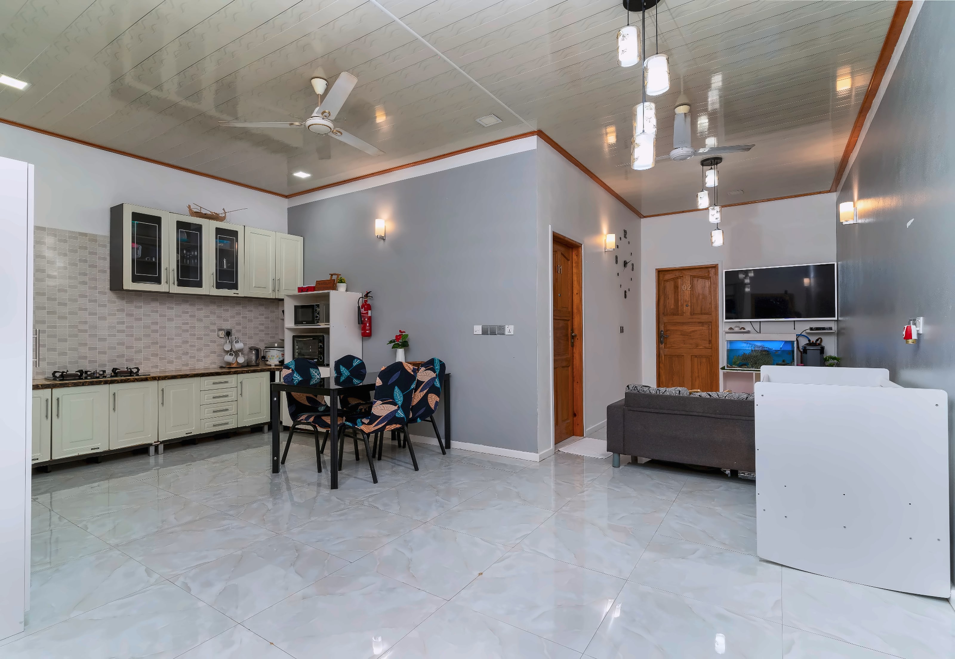 Maafolhey's open-plan kitchen, dining table and living room in one room